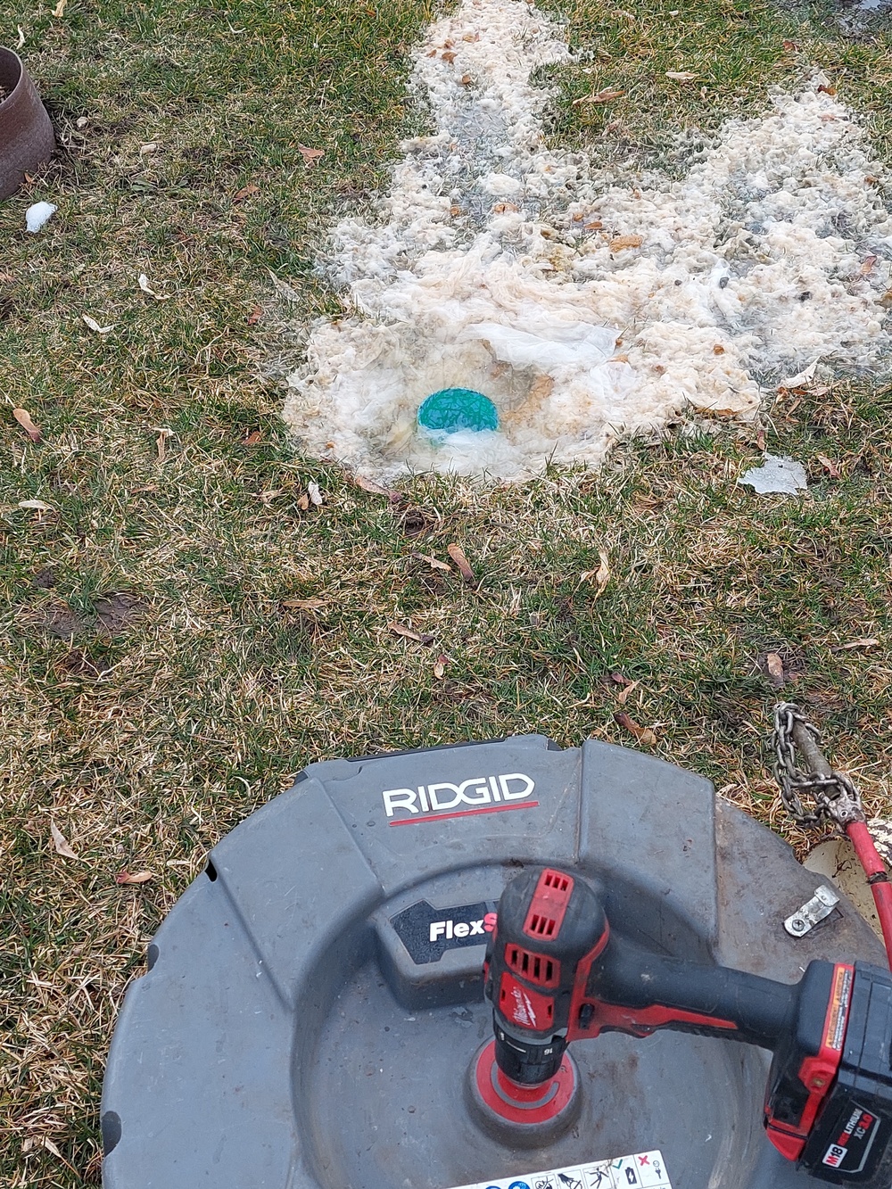 Rhino Rooter equipment is ready outside to fix or clean a sewer pipe in early spring.