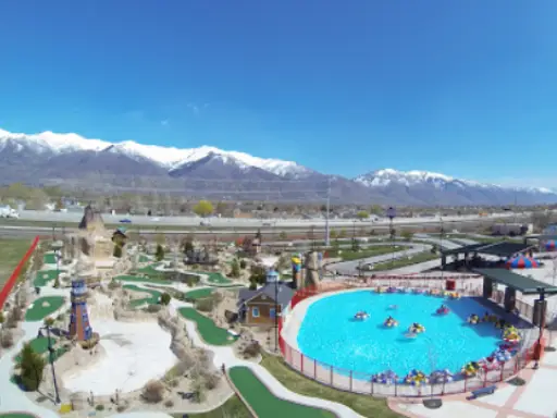 Rhino Rooter alt text: A fun park with mini-golf and bumper boats provides a relaxing getaway for families near the Wasatch Mountains.