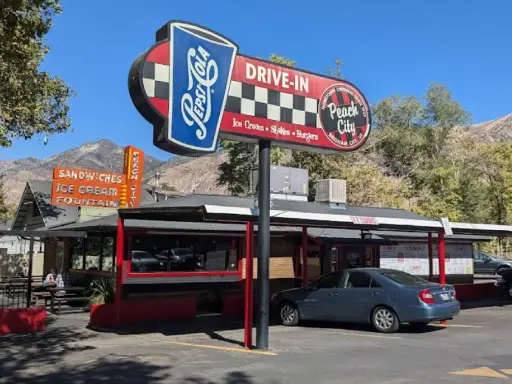 A classic drive-in restaurant serves burgers, shakes, and ice cream. Rhino Rooter offers sewer repair and pipe replacement nearby.