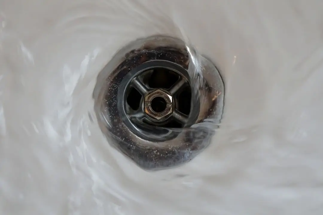 Rhino Rooter showing water quickly draining from a sink, demonstrating effective plumbing and drain cleaning.