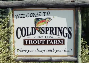A welcome sign at Cold Springs Trout Farm shares their long history and promise of a good catch, like how Rhino Rooter provides smooth pipe service. Alt text: Welcome sign highlights Cold Springs Trout Farm’s history and compares catching fish to Rhino Rooter’s reliable plumbing.
