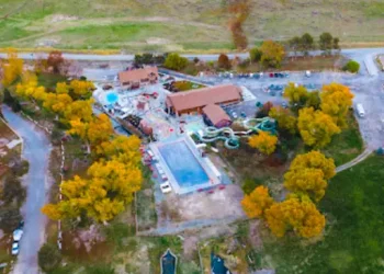 Rhino Rooter maintains a large recreation center with pool and slides, showing expert care in pipe replacement and trenchless repairs.