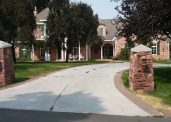 A brick house shows the comfort and security that Rhino Rooter brings with their drain cleaning and pipe replacement services.