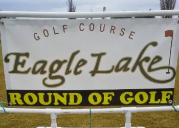 A sign offers a round of golf at Eagle Lake golf course, showing it is a fun spot near where Rhino Rooter provides service.
