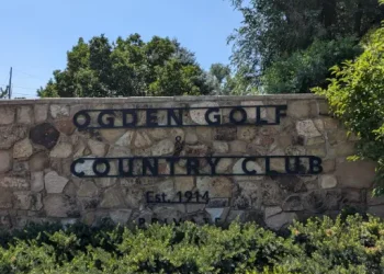 A welcoming entrance sign for Ogden Golf & Country Club shows the pride and care taken by professionals, like Rhino Rooter with drain cleaning.